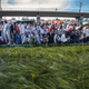 Ethiopians throw grass into a pool of water, as a symbol of riches after the rainy season and to thank the land and water for everything they have provided, as they celebrate the annual Irrecha thanksgiving festival in the capital Addis Ababa, Ethiopia Saturday, Oct. 5, 2019. The annual Irrecha festival of Ethiopia's largest ethnic group, the Oromo, attracted millions from across Ethiopia and was held in the capital for the first time after 150 years on Saturday.